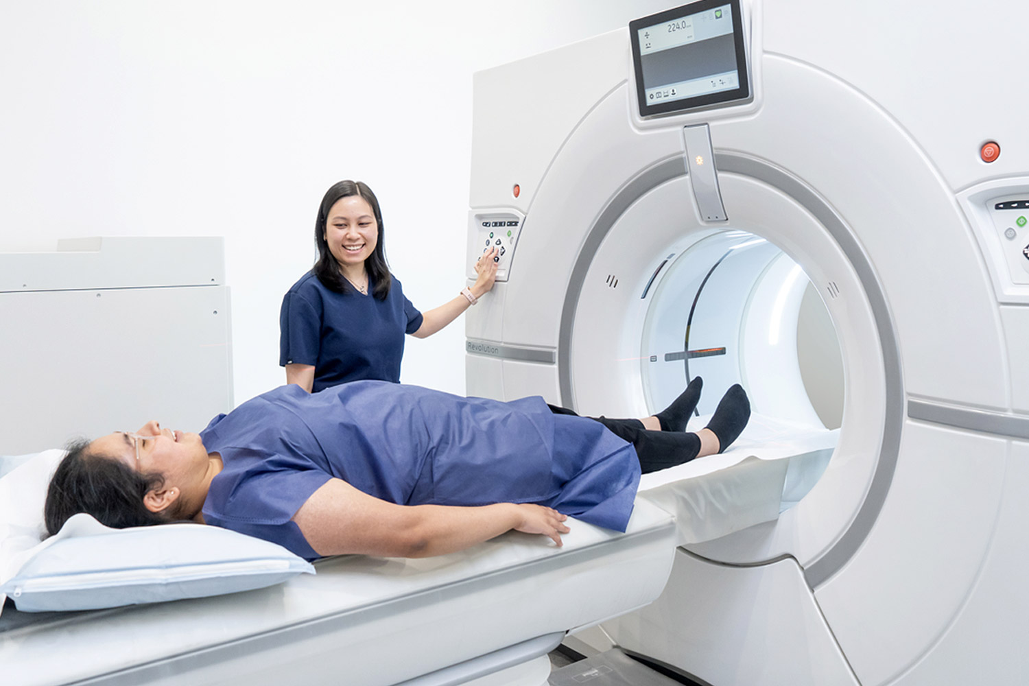 Female Radiologist Preparing Woman for CT Scan | Medical Imaging Services | FMIG