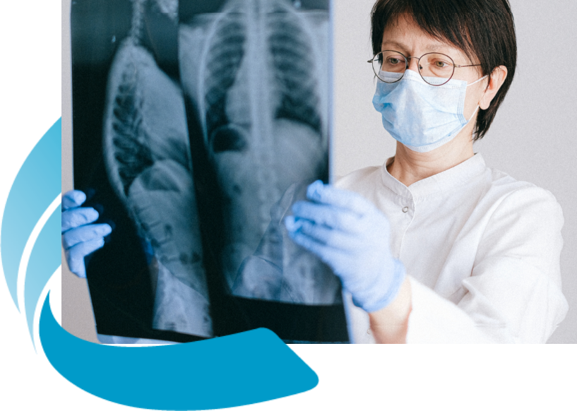 Female Doctor Looking At X Ray Result | Medical Imaging Specialists | FMIG