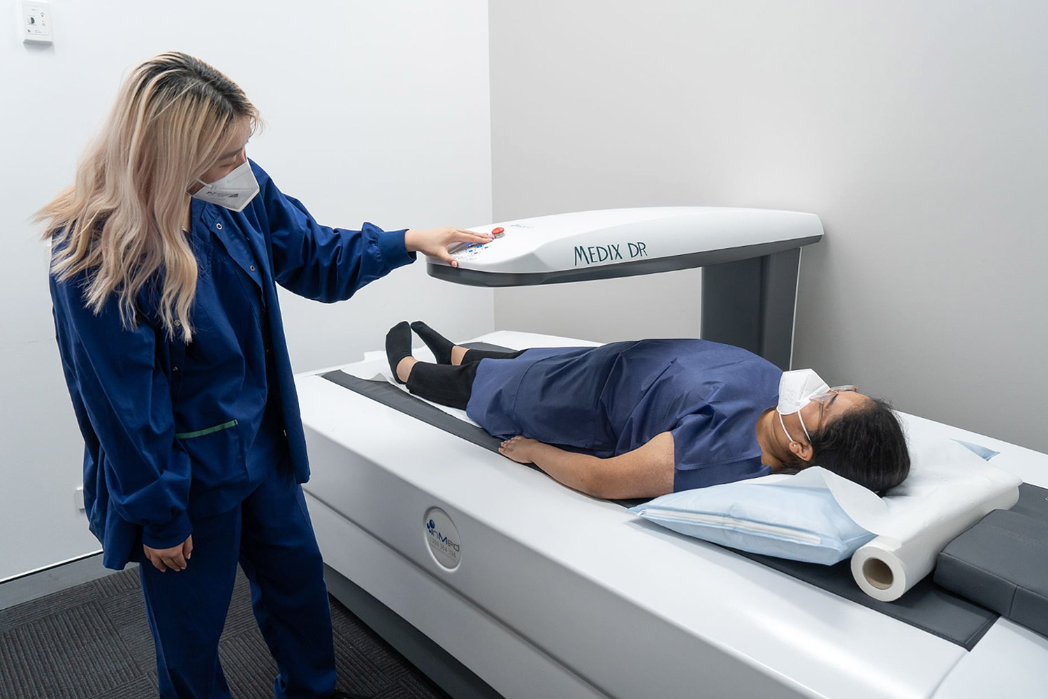 Woman Undergoing Bone Density Scan | Bone Densitometry | FMIG